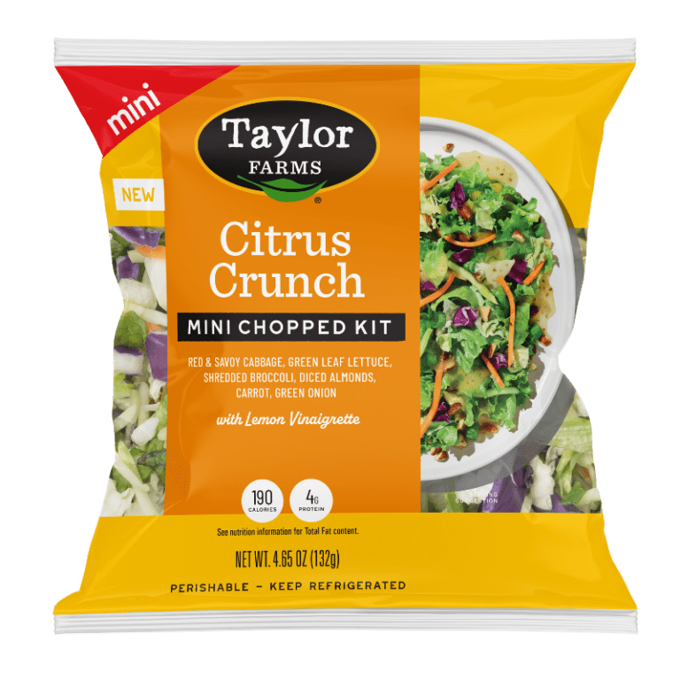 The Taylor Farms Citrus Crunch Mini Chopped Salad Kit package, showing red and savoy cabbage, green leaf lettuce, shredded broccoli, diced almonds, carrots, and green onions, and lemon vinaigrette.