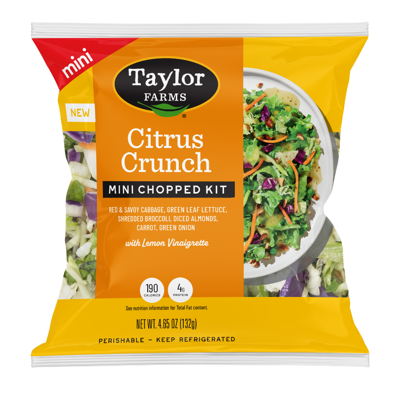 The Taylor Farms Citrus Crunch Mini Chopped Salad Kit package, showing red and savoy cabbage, green leaf lettuce, shredded broccoli, diced almonds, carrots, and green onions, and lemon vinaigrette.