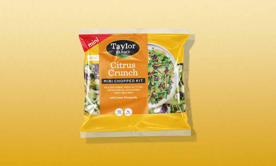 Citrus Crunch Mini Chopped Salad Kit featuring vibrant yellow gradient packaging.