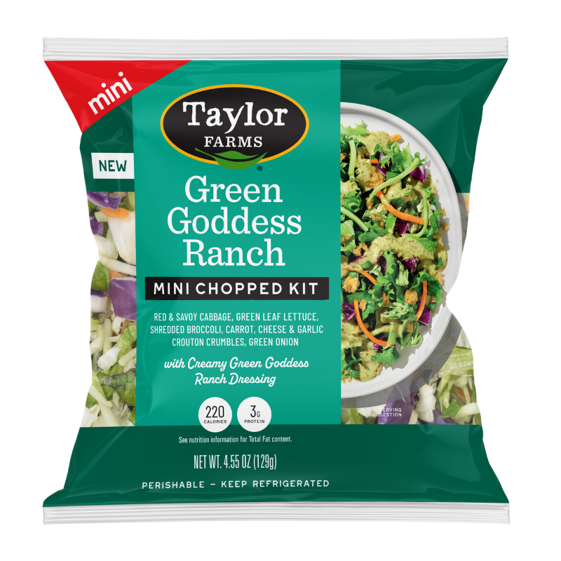 The Taylor Farms Green Goddess Ranch Mini Chopped Salad Kit package, showing red and savoy cabbage, green leaf lettuce, shredded broccoli, carrots, green onions, cheese and garlic crouton crumbles, and Green Goddess Ranch dressing.