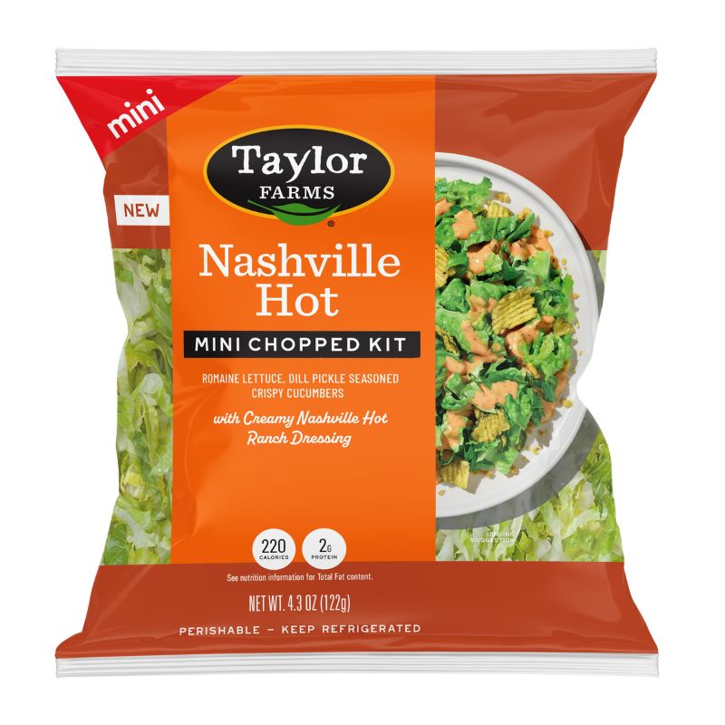 The Taylor Farms Nashville Hot Mini Chopped Salad Kit package, showing chopped romaine lettuce, dill pickle-seasoned crispy cucumbers, and creamy Nashville Hot ranch dressing.