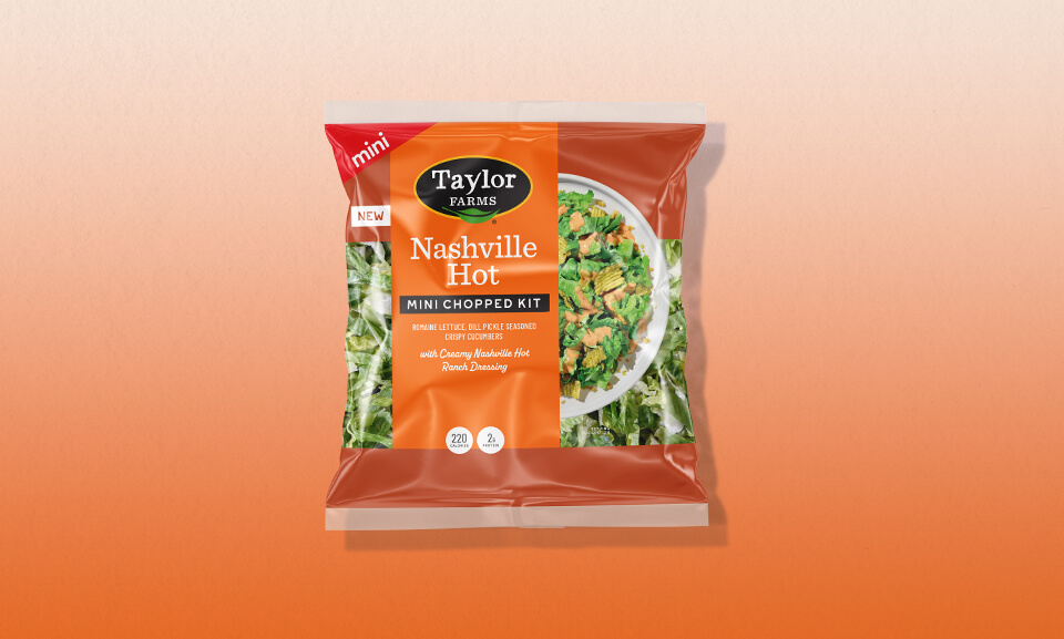 Nashville Hot Mini Chopped Salad Kit with vibrant gradient packaging and fresh ingredients.