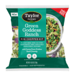 The Taylor Farms Green Goddess Ranch Mini Chopped Salad Kit package, showing red and savoy cabbage, green leaf lettuce, shredded broccoli, carrots, green onions, cheese and garlic crouton crumbles, and Green Goddess Ranch dressing.