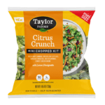 The Taylor Farms Citrus Crunch Mini Chopped Salad Kit package, showing red and savoy cabbage, green leaf lettuce, shredded broccoli, diced almonds, carrots, and green onions, and lemon vinaigrette.