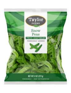 Fresh Taylor Farms snow peas ready for cooking or snacking, showcasing vibrant green color and crisp texture.