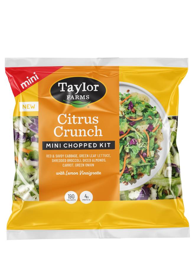 The Taylor Farms Citrus Crunch Mini Chopped Salad Kit package, showing red and savoy cabbage, green leaf lettuce, shredded broccoli, diced almonds, carrots, and green onions, and lemon vinaigrette.