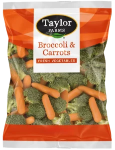 Fresh broccoli and carrots on a wooden background, perfect for healthy meal prep and side dishes.