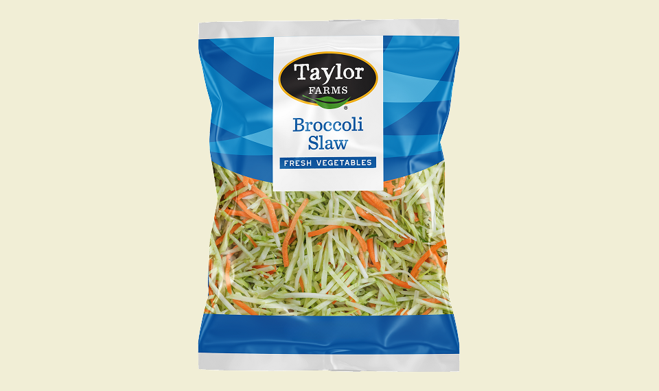Colorful broccoli slaw mix displayed on a slider bun, topped with fresh vegetables and dressing.