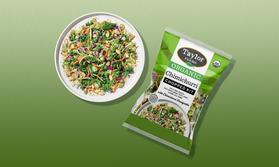 Fresh organic chimichurri chopped salad kit served on a plate, showcasing vibrant greens and garnishes.
