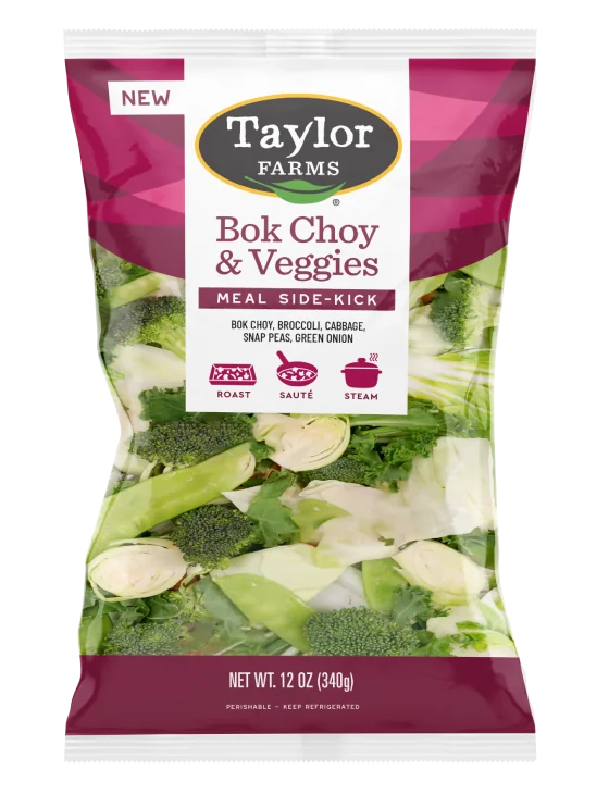 The Taylor Farms Bok Choy & Veggies package, showing chopped bok choy, broccoli, cabbage, snap peas, and green onion.