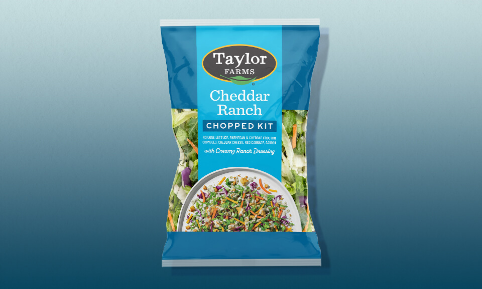 Cheddar Ranch Chopped Salad Kit with vibrant greens and dressing, perfect for a fresh meal option.