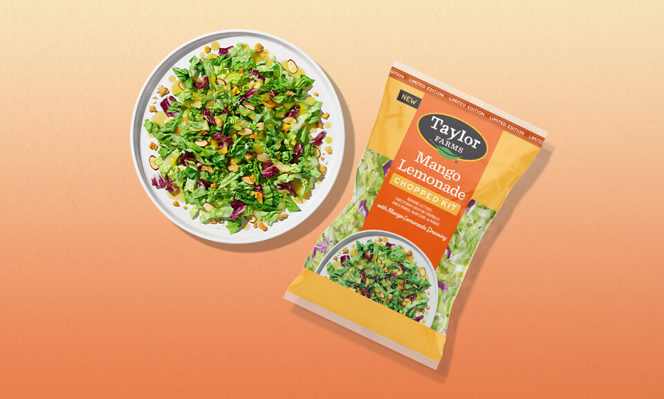 Fresh Mango Lemonade Chopped Salad Kit served on a plate, showcasing vibrant greens, mango, and zesty lemon dressing.