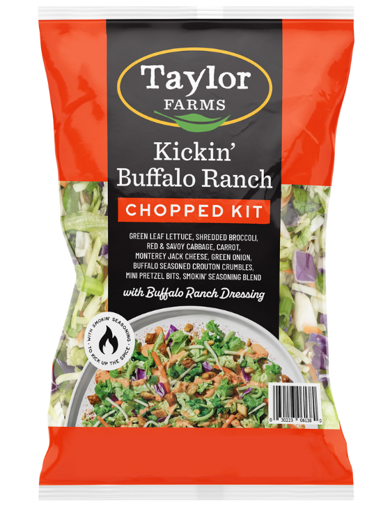 A package of the Taylor Farms Kickin’ Buffalo Ranch Chopped Salad kit, with green leaf lettuce, shredded broccoli, red & savoy cabbage, Monterey Jack cheese, Buffalo-seasoned croutons, mini pretzels, and Buffalo Ranch Dressing.