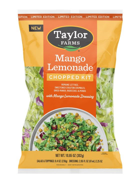 The Taylor Farms Mango Lemonade Chopped Salad Kit package, showing romaine lettuce, radicchio, sliced almonds, crouton crumbles, dried mango pieces, and the mango lemonade vinaigrette.