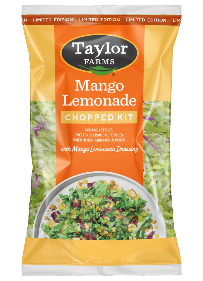 The Taylor Farms Mango Lemonade Chopped Salad Kit package, showing romaine lettuce, radicchio, sliced almonds, crouton crumbles, dried mango pieces, and the mango lemonade vinaigrette.