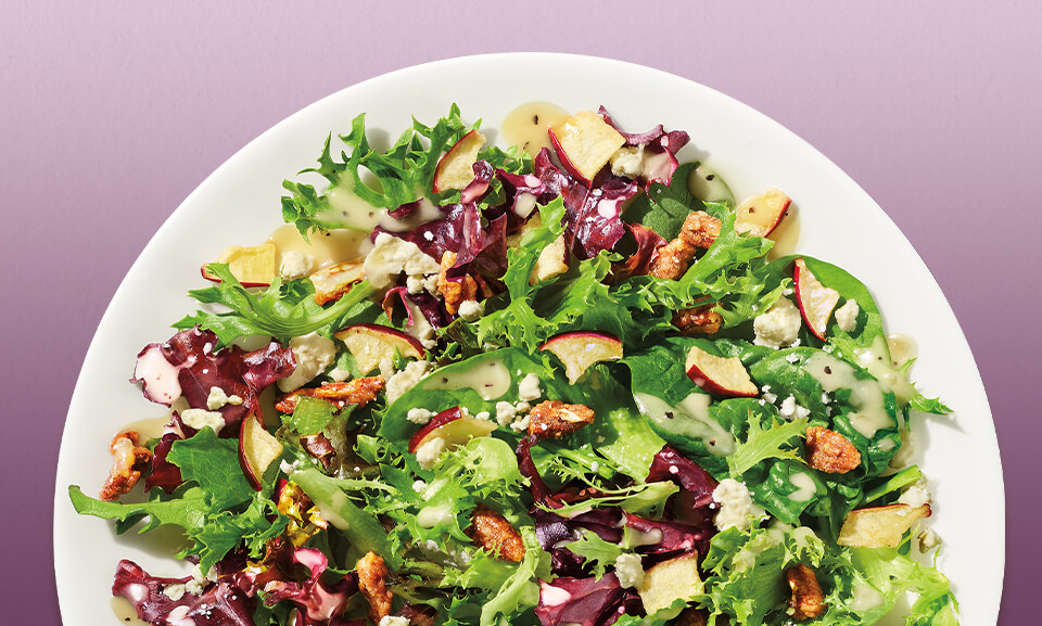 Apple pecan salad kit featuring fresh greens, crunchy pecans, and vibrant apple slices, perfect for a healthy meal.