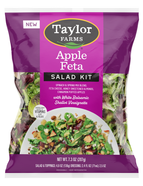 The Taylor Farms Apple Feta Salad Kit package, showing spinach, spring mix, feta cheese bits, almonds, pieces of puffed apple, and white balsamic shallot vinaigrette.