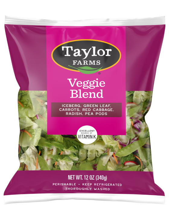 The Taylor Farms Veggie Blend package, chopped iceberg lettuce, green leaf lettuce, carrots, red cabbage, radishes, and pea pods.