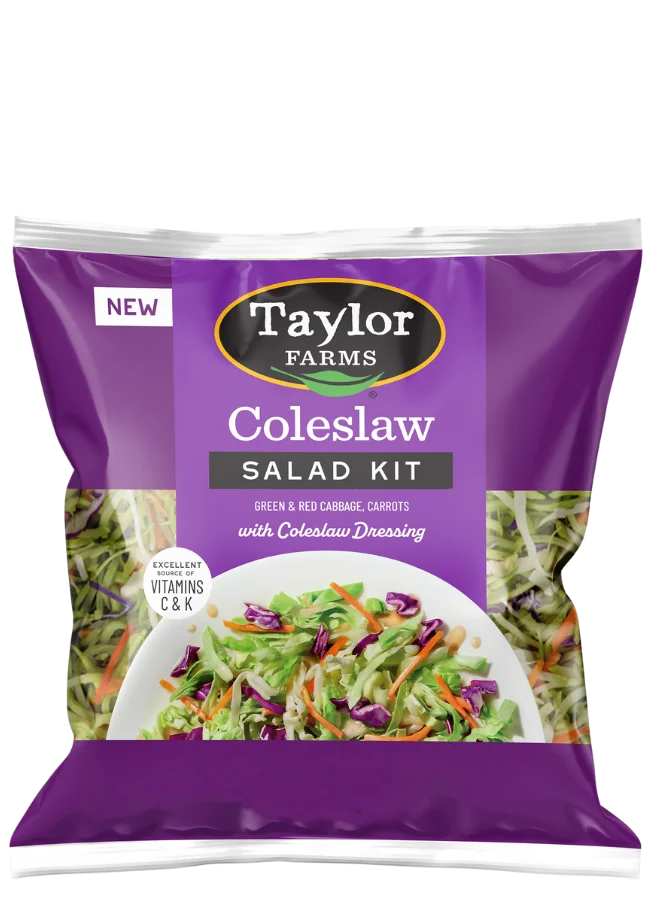 The Taylor Farms Coleslaw Salad Kit package, showing shredded green and red cabbage, carrots, and the included coleslaw dressing.