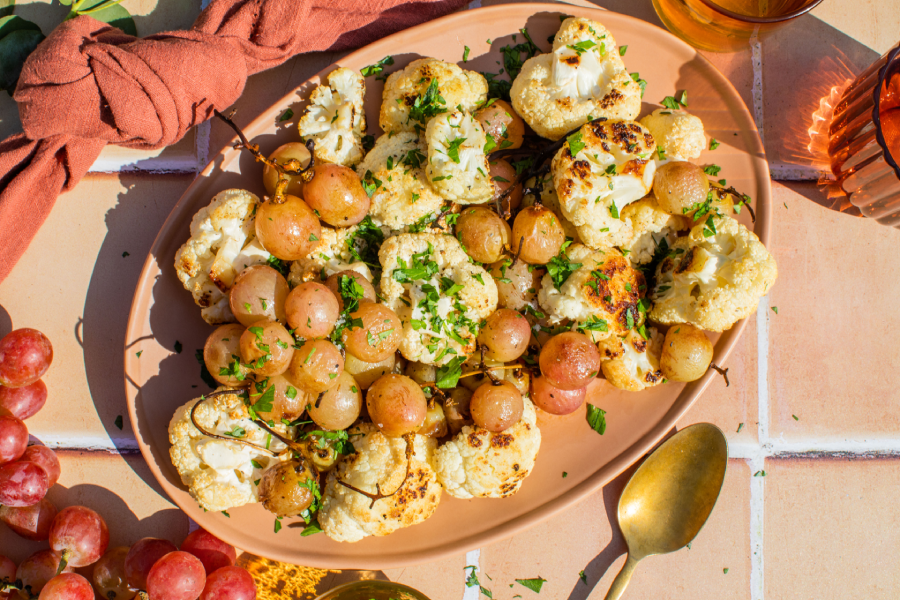 Roasted cauliflower and grapes on a plate