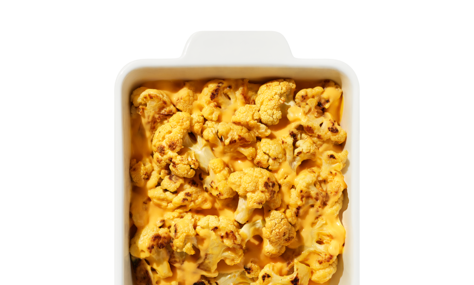 Cauliflower mac and cheese roast kit featuring fresh cauliflower and creamy cheese sauce, perfect for a healthy meal.