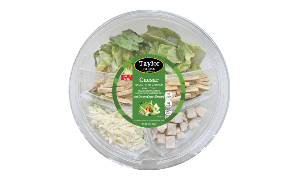 Caesar salad bowl with grilled chicken from Taylor Farms, featuring crisp romaine, parmesan, and creamy dressing.
