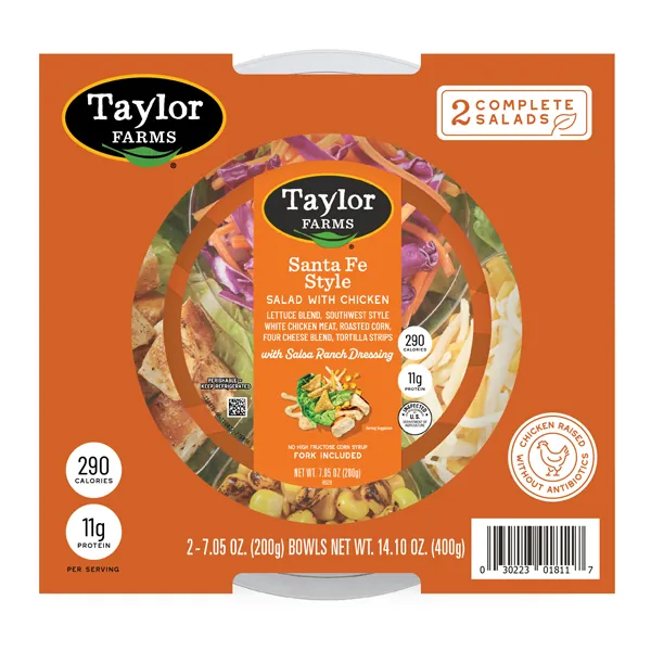 The Taylor Farms Santa Fe Salad Bowl package, showing chopped lettuce, carrot, and cabbage, white meat chicken, roasted corn, and shredded cheese.