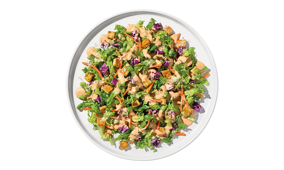 Taylor Farms Pizza Ranch Chopped Salad Kit featuring fresh vegetables and toppings in a convenient pack.