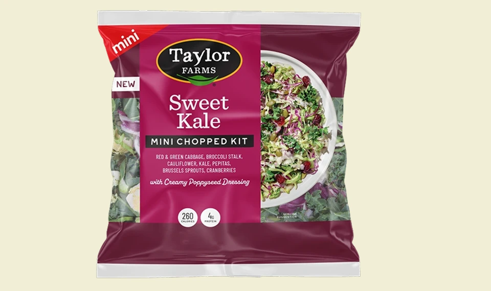 Sweet kale salad mix featuring a variety of fresh greens and vibrant toppings for a healthy meal option.