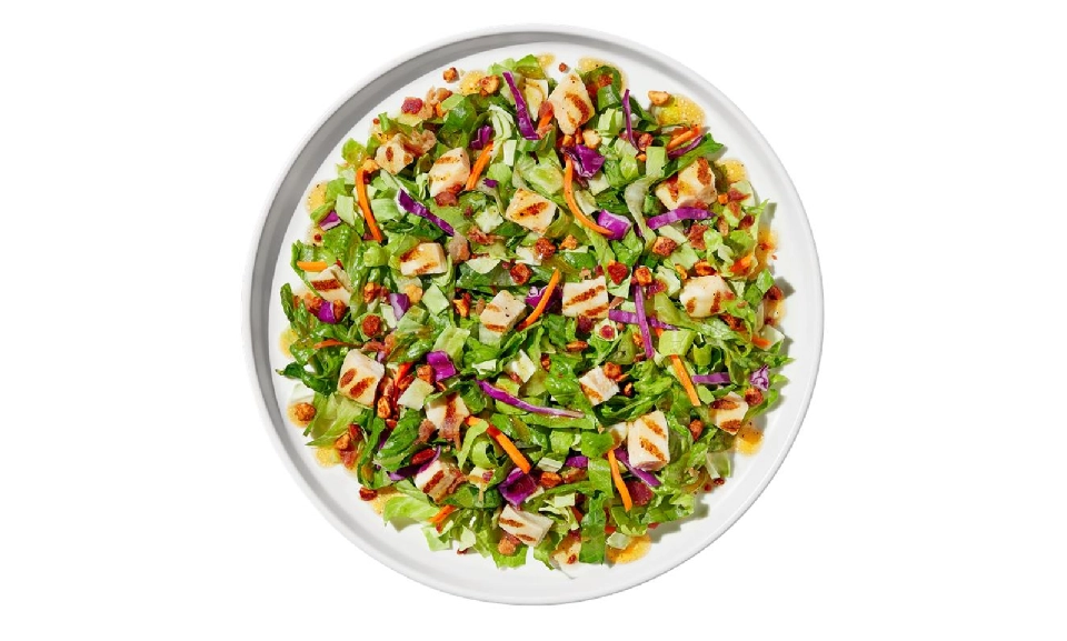 Maple Bourbon Chop Salad with fresh greens, vibrant veggies, and a delicious dressing.