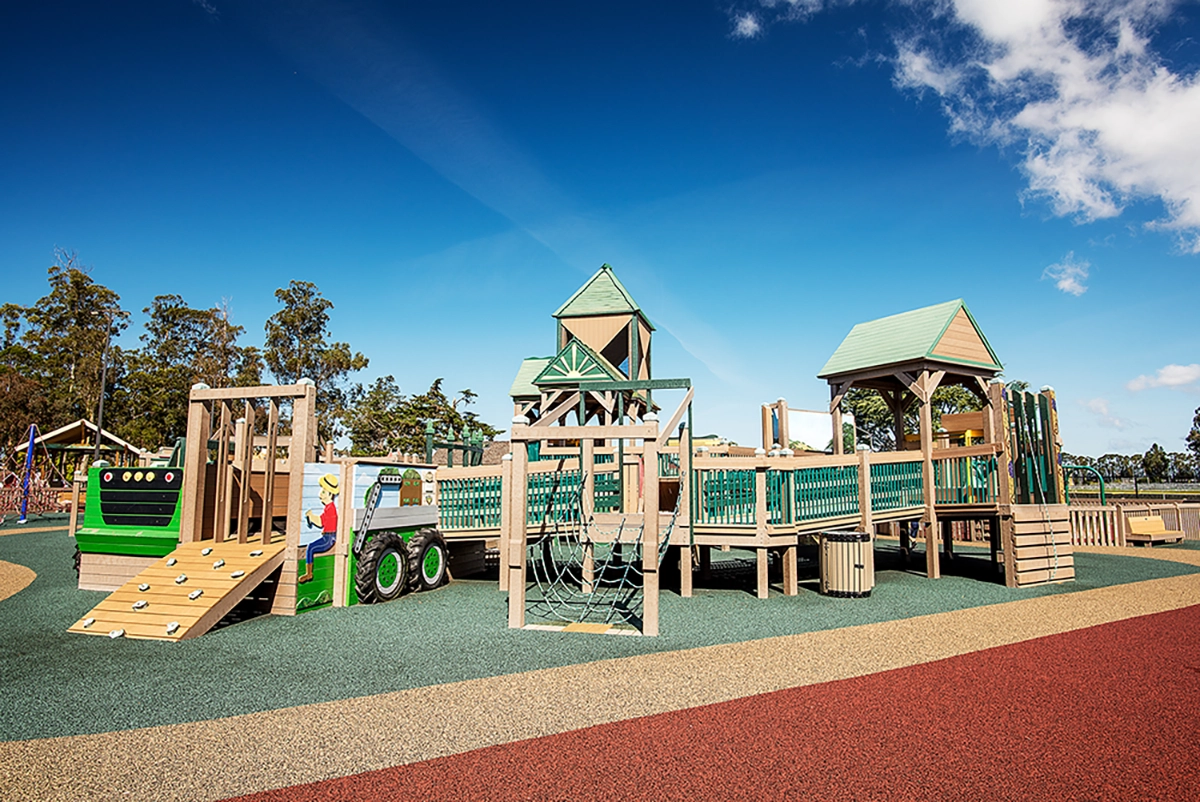 Tatum's Treehouse at Taylor Farms, featuring a whimsical design and colorful surroundings for children's outdoor play.