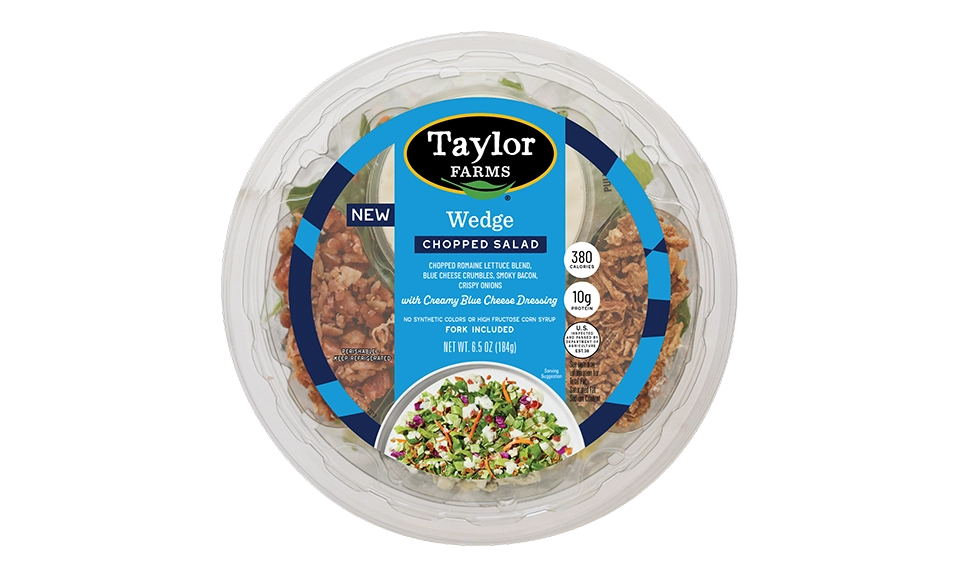 Taylor Farms wedge chopped salad bowl featuring fresh vegetables and dressing, ideal for healthy meal options.