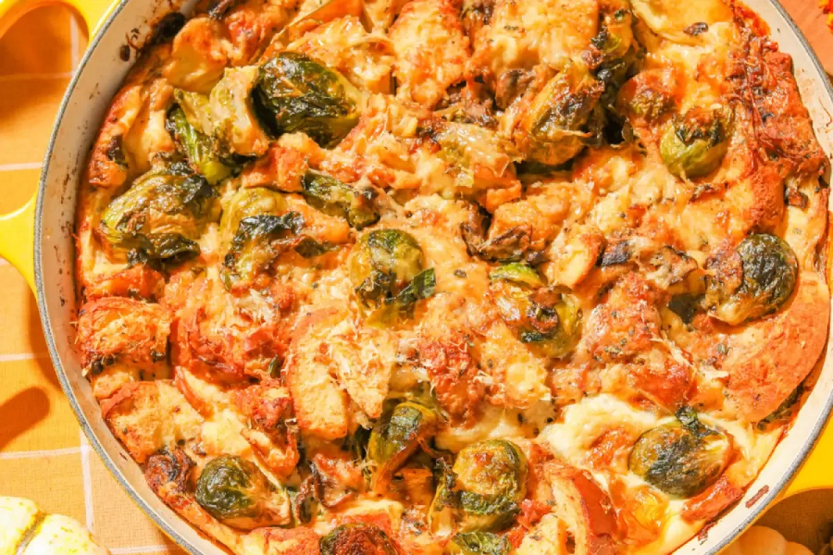 Cheesy Brussels sprouts bread pudding topped with golden brown crust, perfect for a cozy meal or holiday gathering.