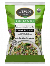 The Organic Chimichurri Chopped Salad Kit package with green leaf lettuce, organic green & red cabbage, broccoli, cauliflower, chicory, carrots, kale, toasted quinoa & sliced almonds, with chimichurri vinaigrette